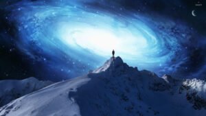 A person standing on top of a mountain with a blue galaxy in the background. A perfect human can reflect God’s attributes.